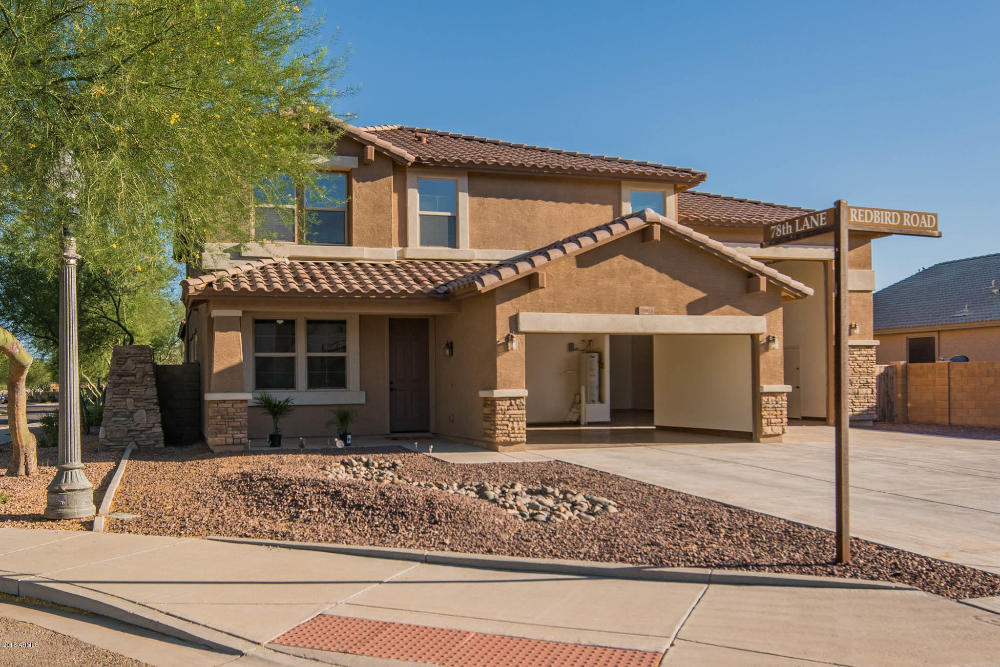 7863 West Redbird Road Peoria, AZ 85383 - Photo 35 of 43 a view of a house with a outdoor space