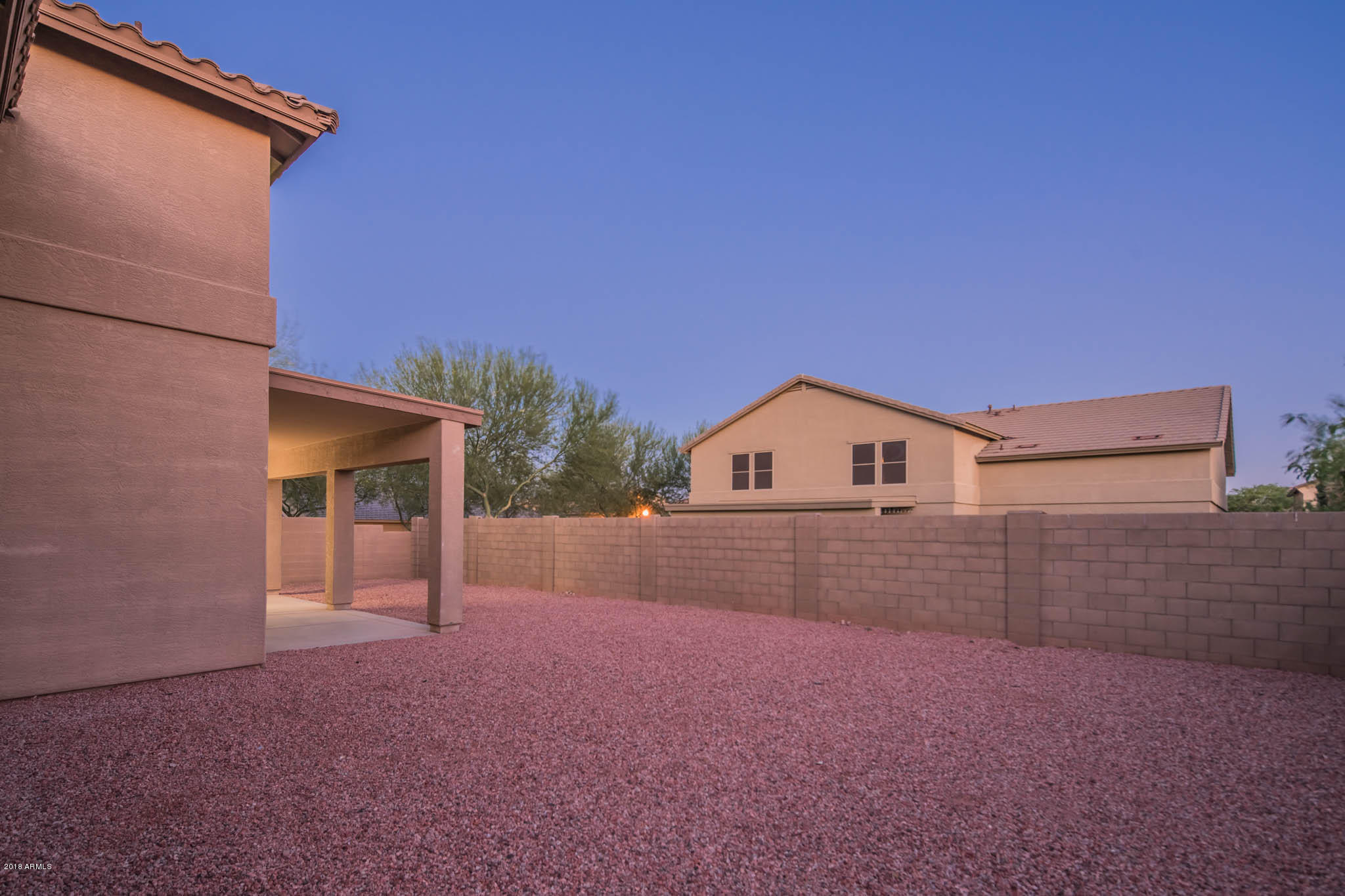 7863 West Redbird Road Peoria, AZ 85383 - Photo 41 of 43 a view of a house with a yard