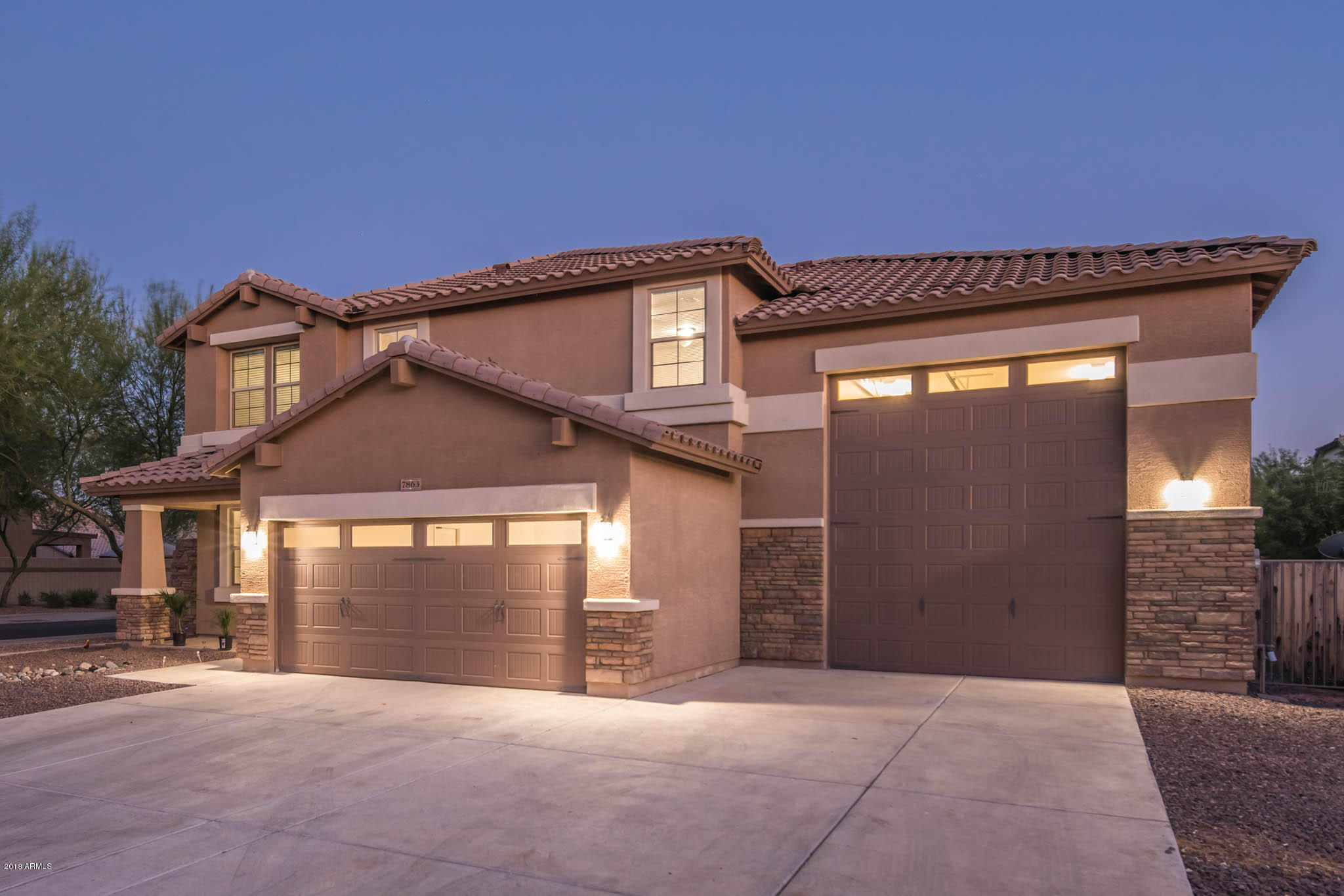 7863 West Redbird Road Peoria, AZ 85383 - Photo 43 of 43 a front view of a house with a garage