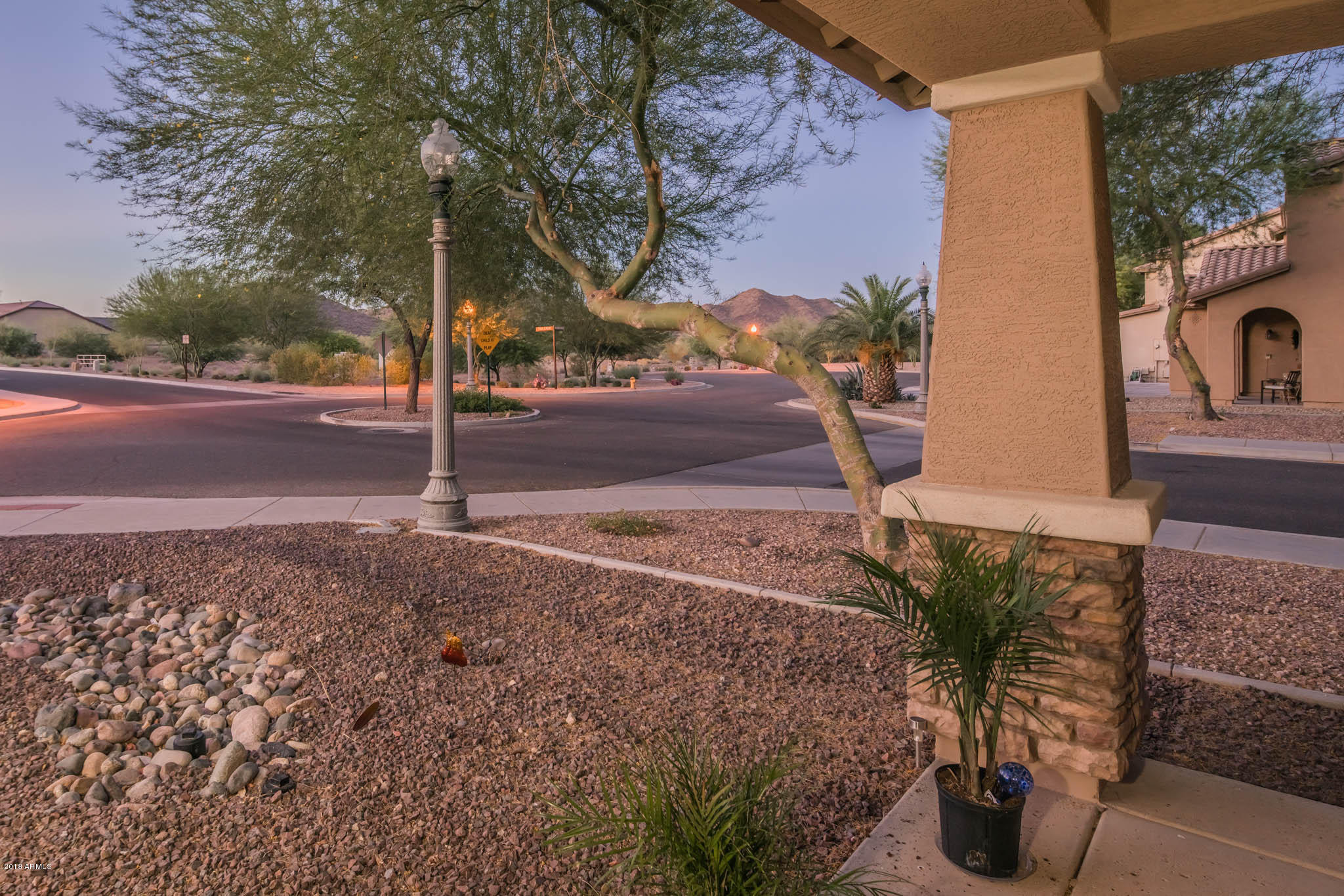 7863 West Redbird Road Peoria, AZ 85383 - Photo 6 of 43 a street view with tall buildings