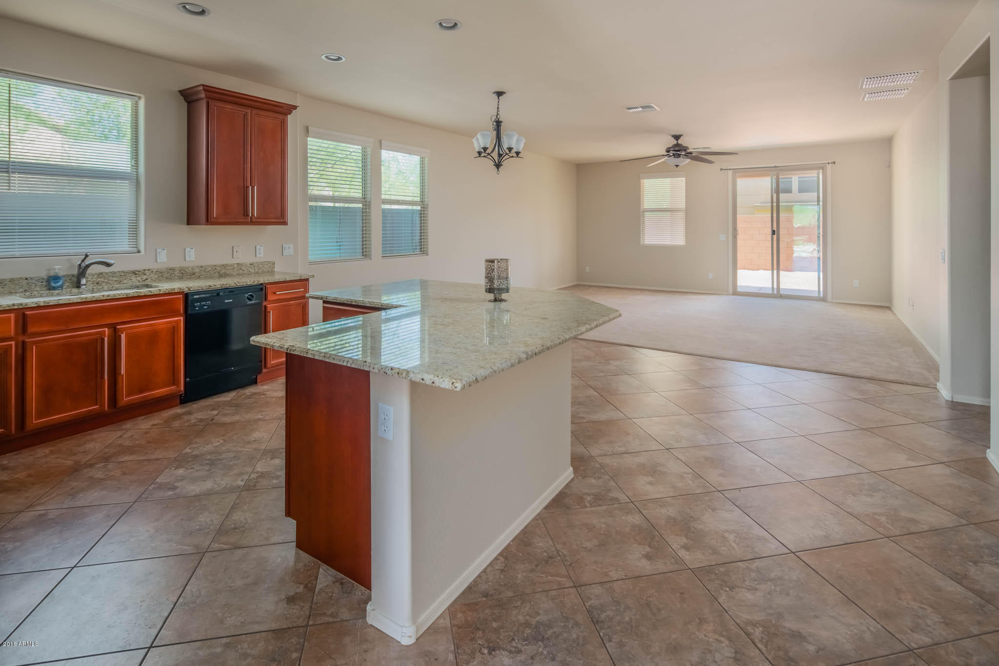 7863 West Redbird Road Peoria, AZ 85383 - Photo 8 of 43 a kitchen with stainless steel appliances granite countertop a sink and cabinets