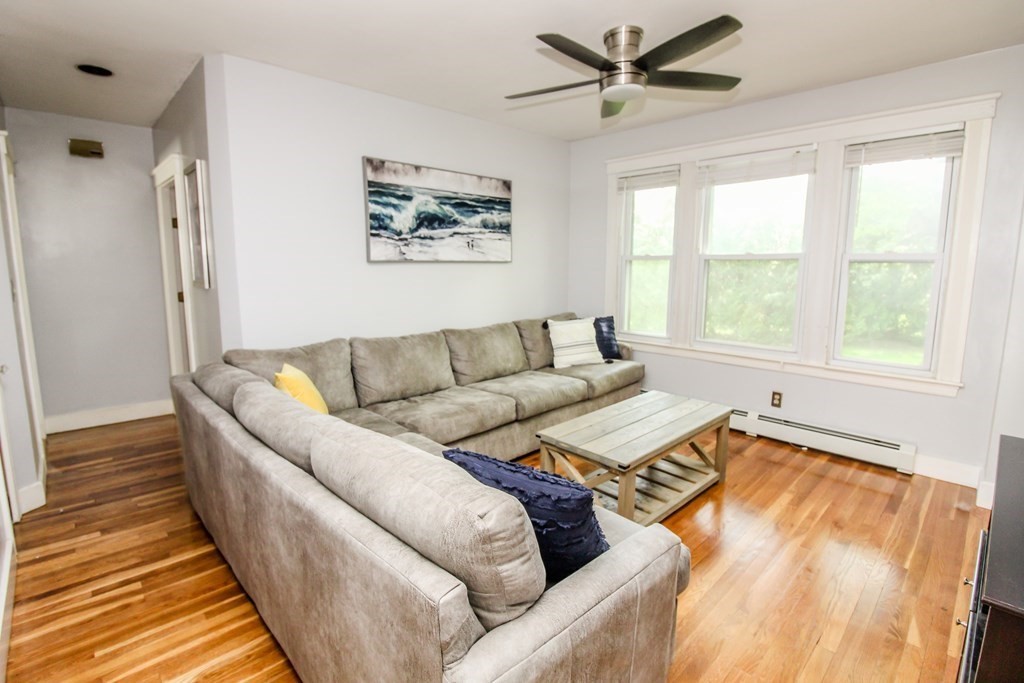 105 Bailey Road Holden, MA 01520 - Photo 19 of 42 a living room with furniture and a large window