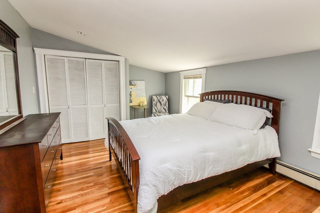 105 Bailey Road Holden, MA 01520 - Photo 23 of 42 a bedroom with a bed and wooden floor