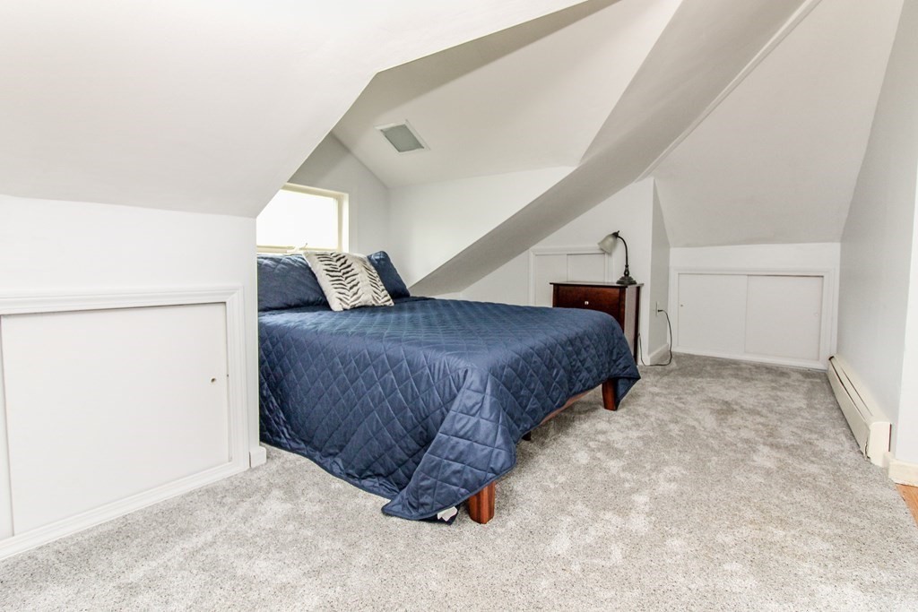 105 Bailey Road Holden, MA 01520 - Photo 25 of 42 a spacious bedroom with a bed and a cabinets