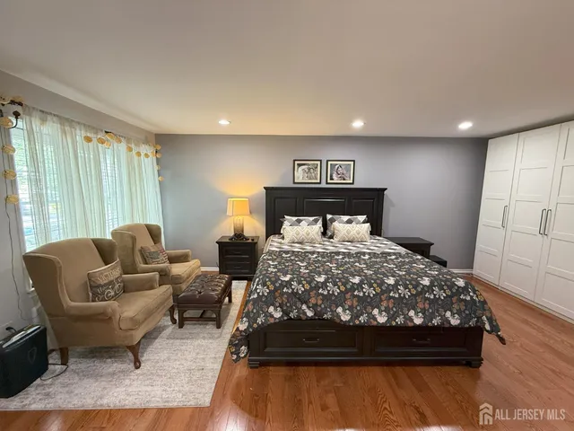 a bedroom with a bed and a couch
