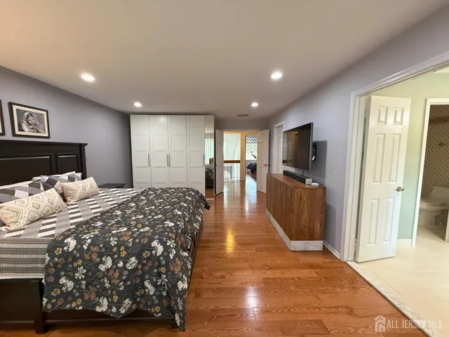 a bed room with a bed and a television