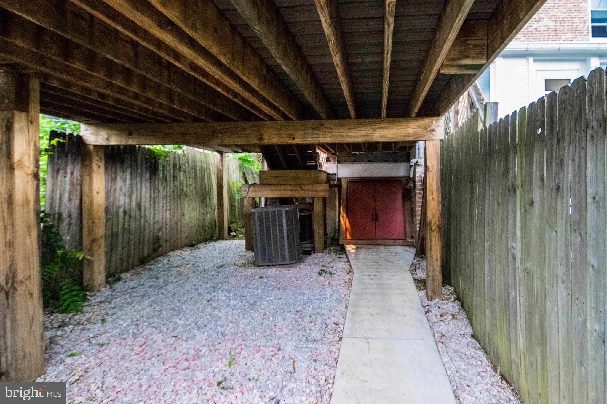 3612 Roland Avenue Baltimore, MD 21211 - Photo 46 of 53 Space under rear deck with entrance to basement