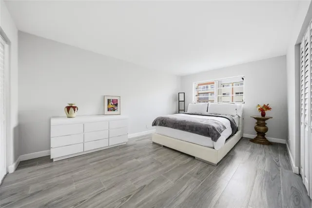 a bedroom with a bed and a closet