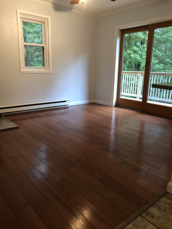 120 Brickyard Road Southampton, MA 01073 - Photo 6 of 28 an empty room with wooden floor and windows