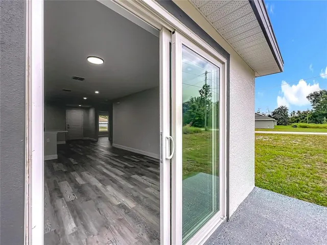 a view of a yard with a tree