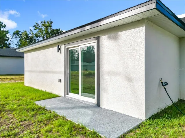 a view of a backyard of the house