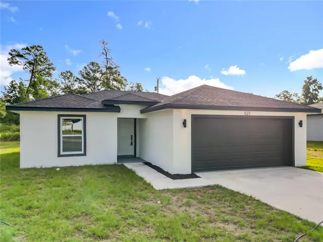 a aerial view of a house with a yard