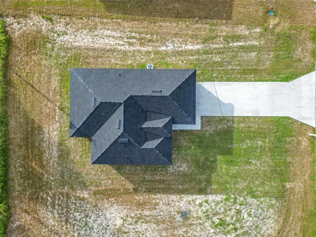 a view of a swimming pool with a yard