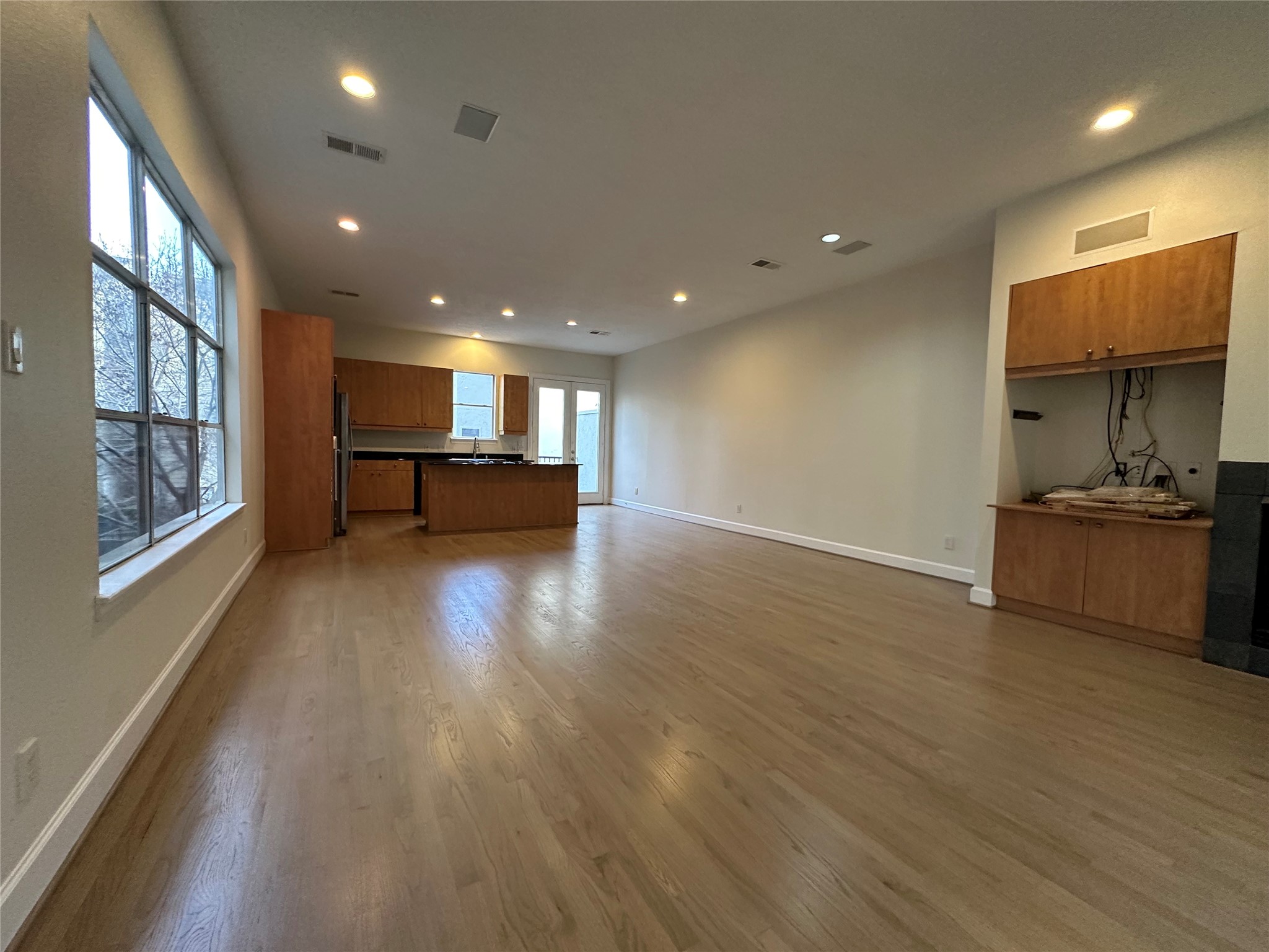 2713 Crawford Street Houston, TX 77004 - Photo 11 of 27 a view of kitchen with natural light and wooden floor