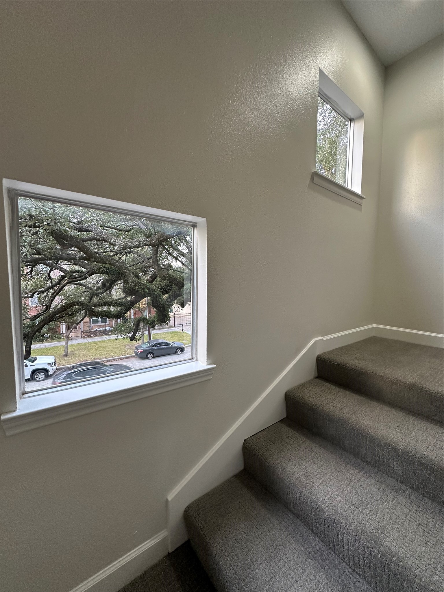 2713 Crawford Street Houston, TX 77004 - Photo 15 of 27 a view of a hallway with a couch and a window