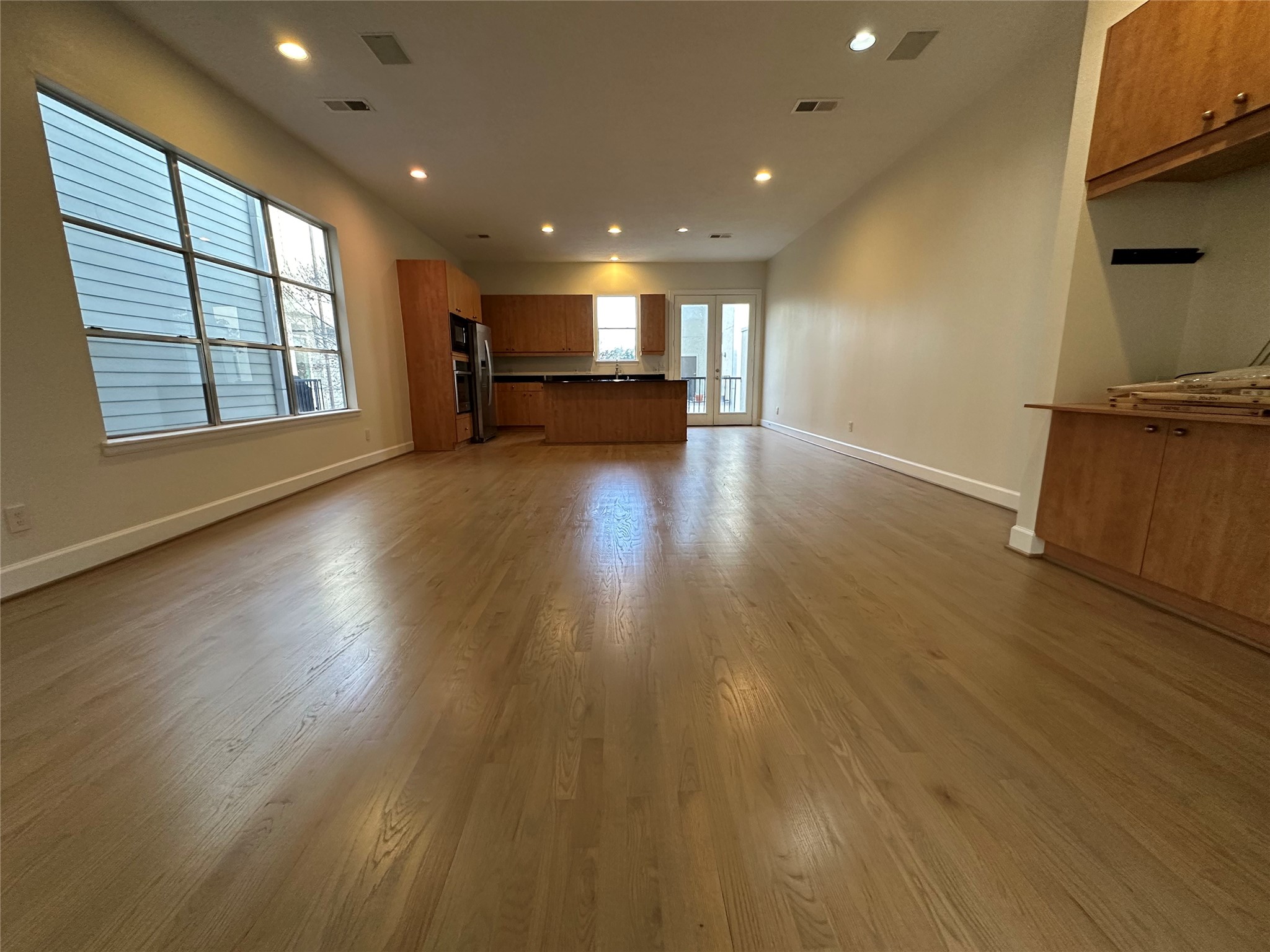 2713 Crawford Street Houston, TX 77004 - Photo 2 of 27 a view of empty room with wooden floor and fan