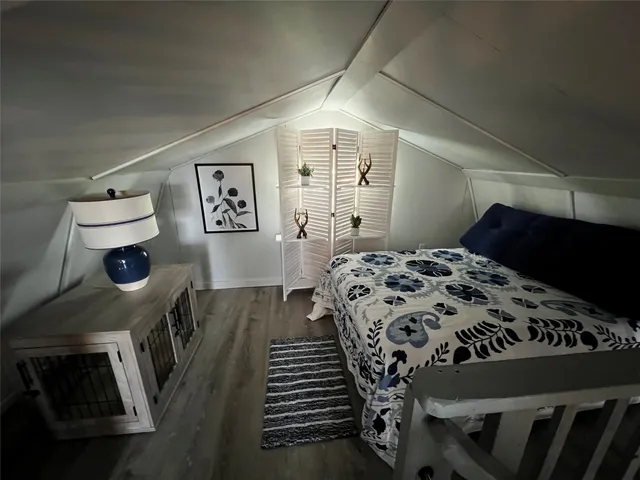 a view of swimming pool with yard from inside of room