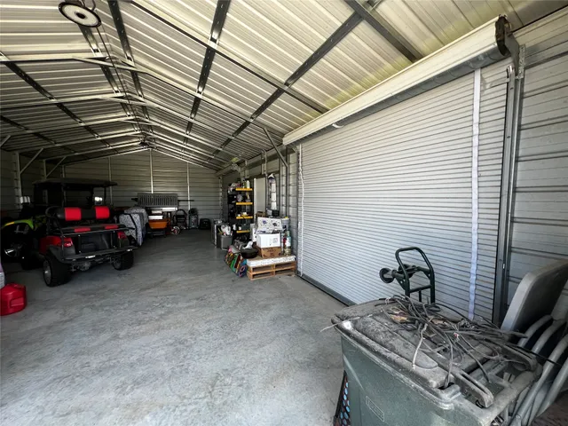 a view of a garage with the red couch