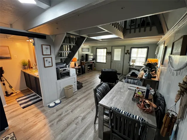 a kitchen with a refrigerator and cabinets