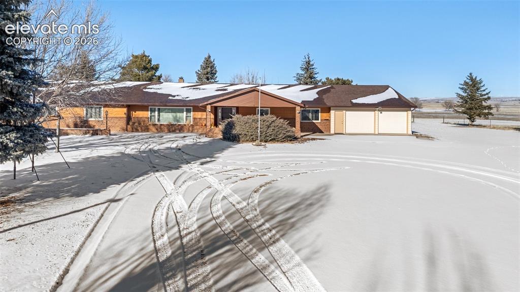 24760 Jones Road Calhan, CO 80808 - Photo 16 of 20 Front of home after snowfall
