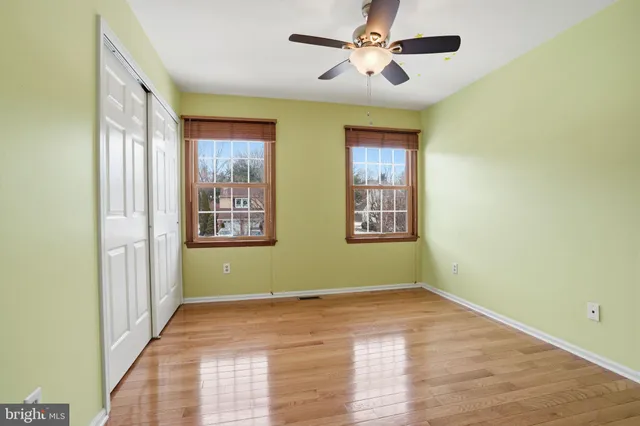 a view of room with window and ceiling fan
