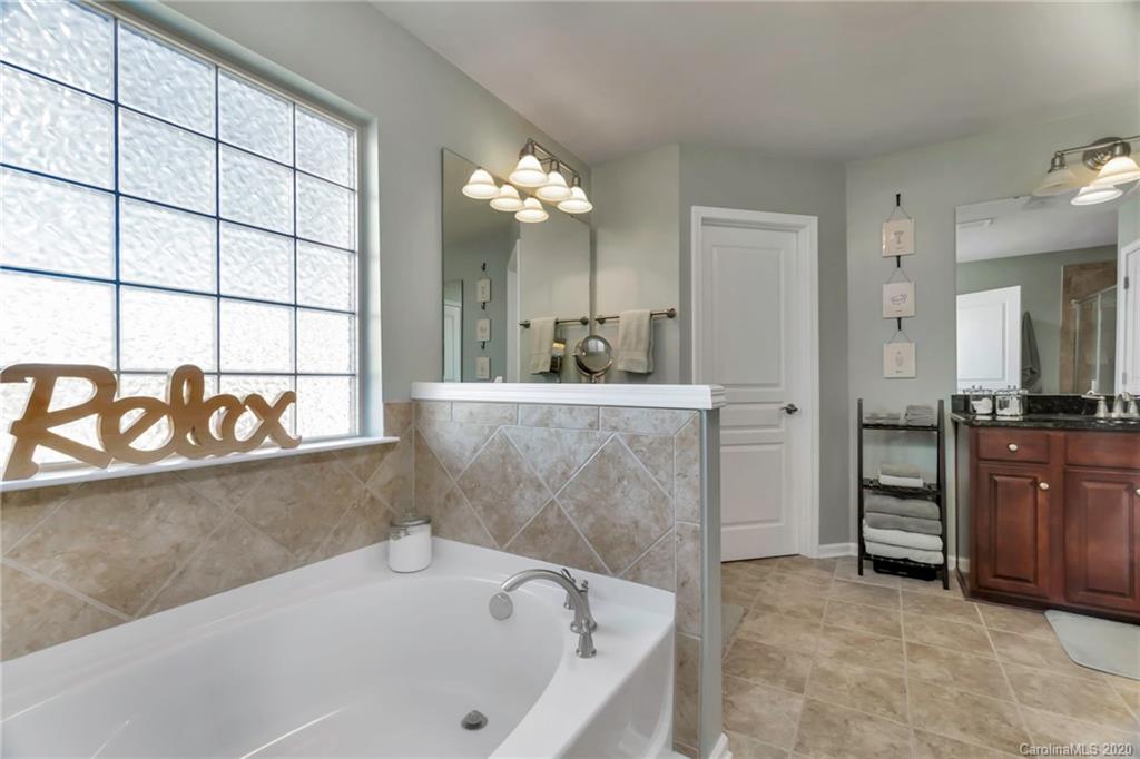 1521 Ridgehaven Road Waxhaw, NC 28173 - Photo 14 of 29 a bathroom with a bathtub and a sink