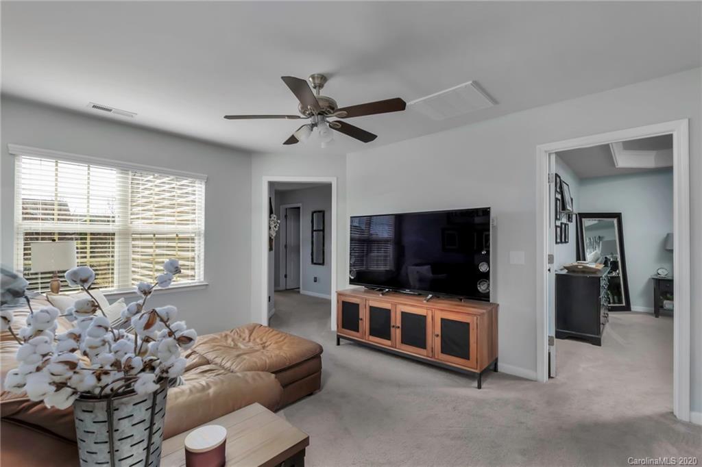 1521 Ridgehaven Road Waxhaw, NC 28173 - Photo 20 of 29 a living room with furniture and a flat screen tv
