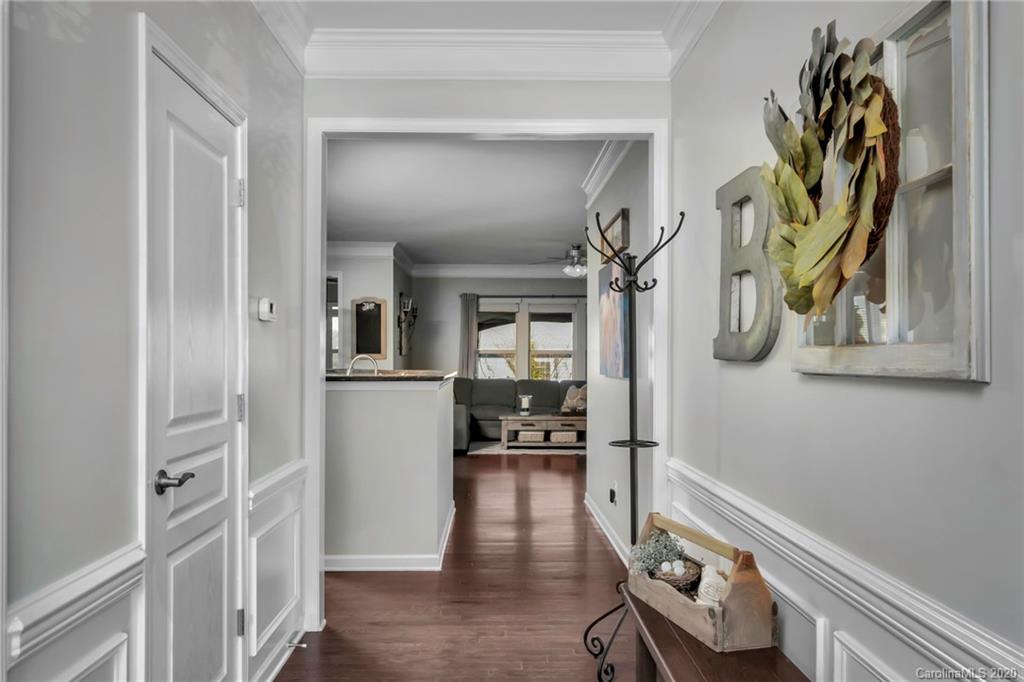 1521 Ridgehaven Road Waxhaw, NC 28173 - Photo 22 of 29 a view of a hallway with wooden floor and a living room