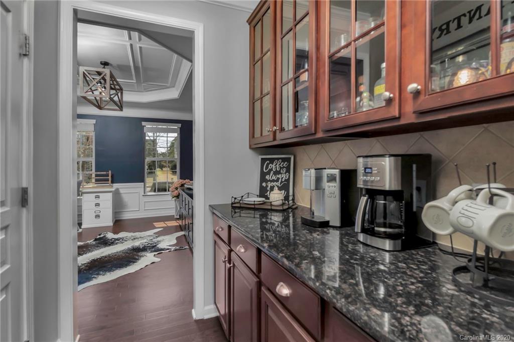 1521 Ridgehaven Road Waxhaw, NC 28173 - Photo 5 of 29 a kitchen with stainless steel appliances granite countertop a stove and cabinets