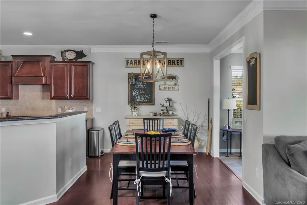 1521 Ridgehaven Road Waxhaw, NC 28173 - Photo 7 of 29 a view of a dining room with furniture window and wooden floor
