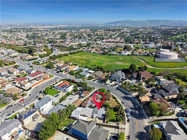 an aerial view of residential houses with outdoor space