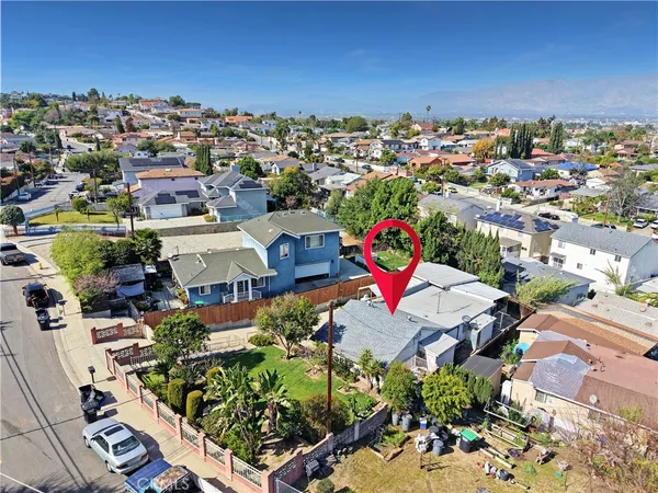 an aerial view of a houses with outdoor space