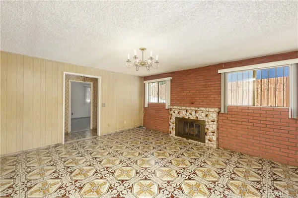 a view of a livingroom with a dinning space and a bathroom