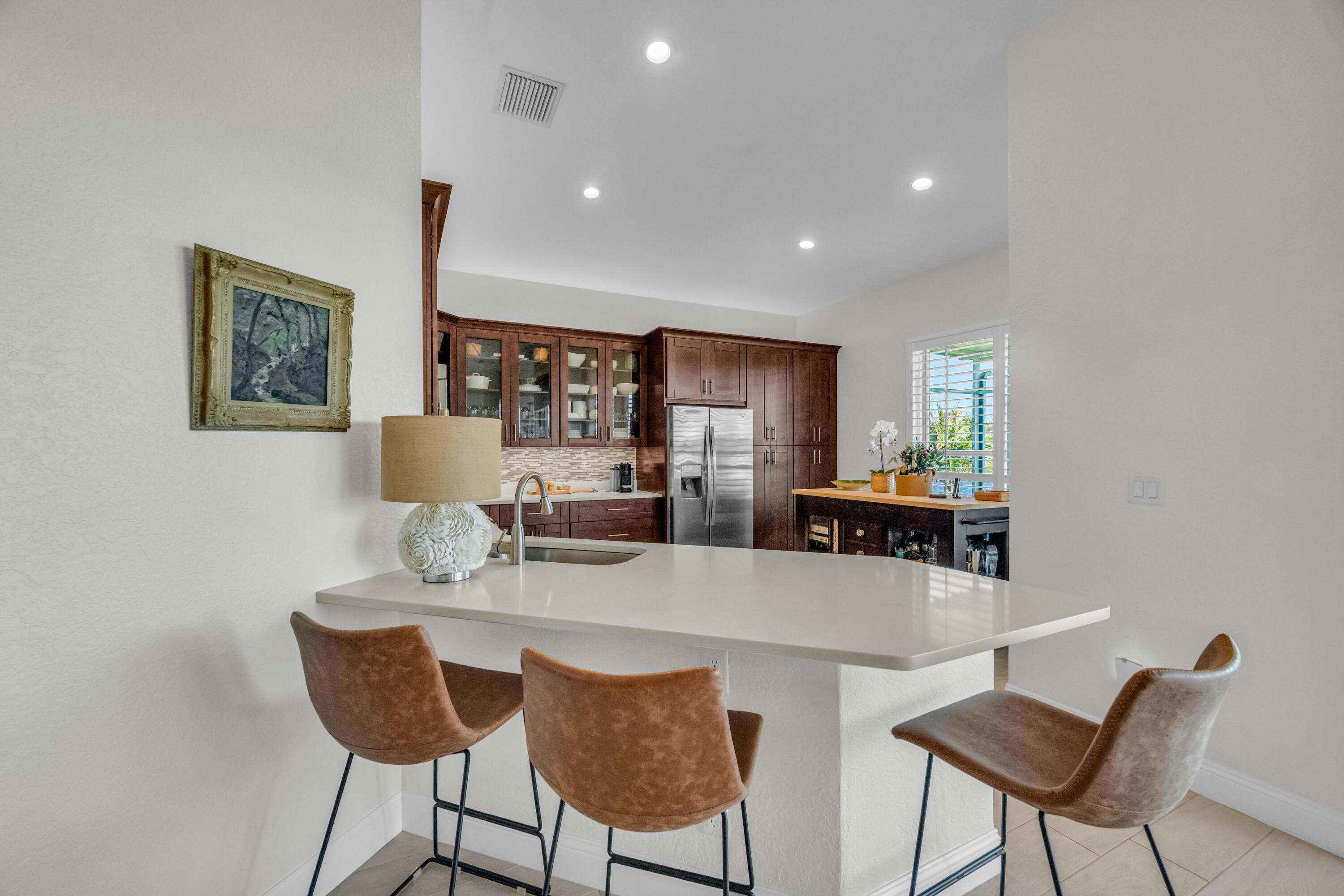 5902 Walnut Park Lane Fort Pierce, FL 34951 - Photo 13 of 45 a dining room with furniture and a wooden floor