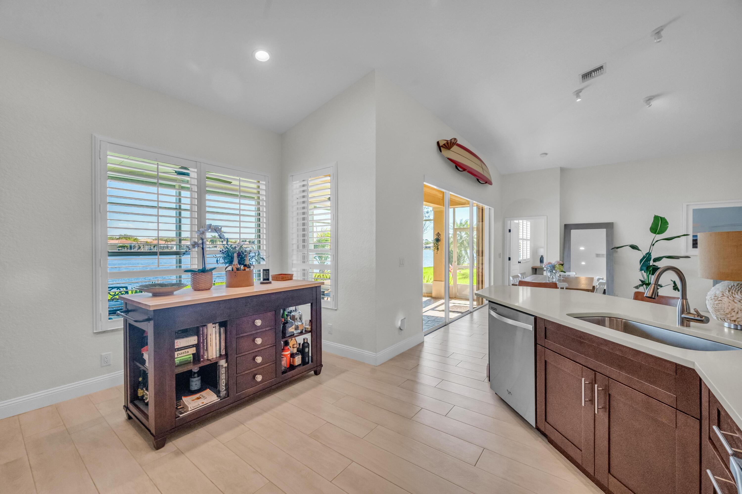5902 Walnut Park Lane Fort Pierce, FL 34951 - Photo 14 of 45 a kitchen with stainless steel appliances granite countertop a stove and a sink