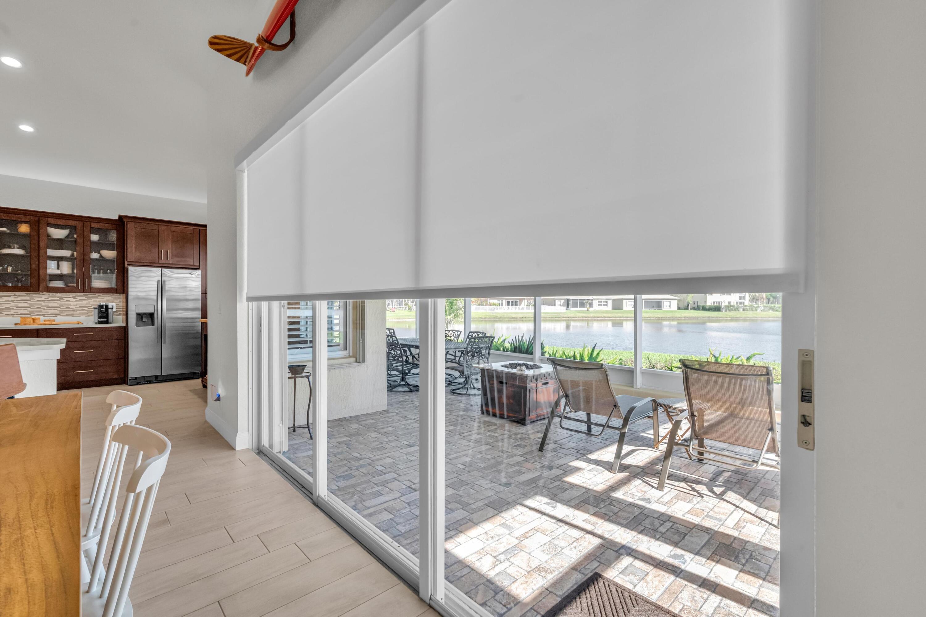 5902 Walnut Park Lane Fort Pierce, FL 34951 - Photo 29 of 45 a living room with a large window and furniture