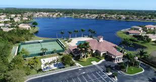 5902 Walnut Park Lane Fort Pierce, FL 34951 - Photo 41 of 45 an aerial view of a house with a yard lake view and mountain view in back