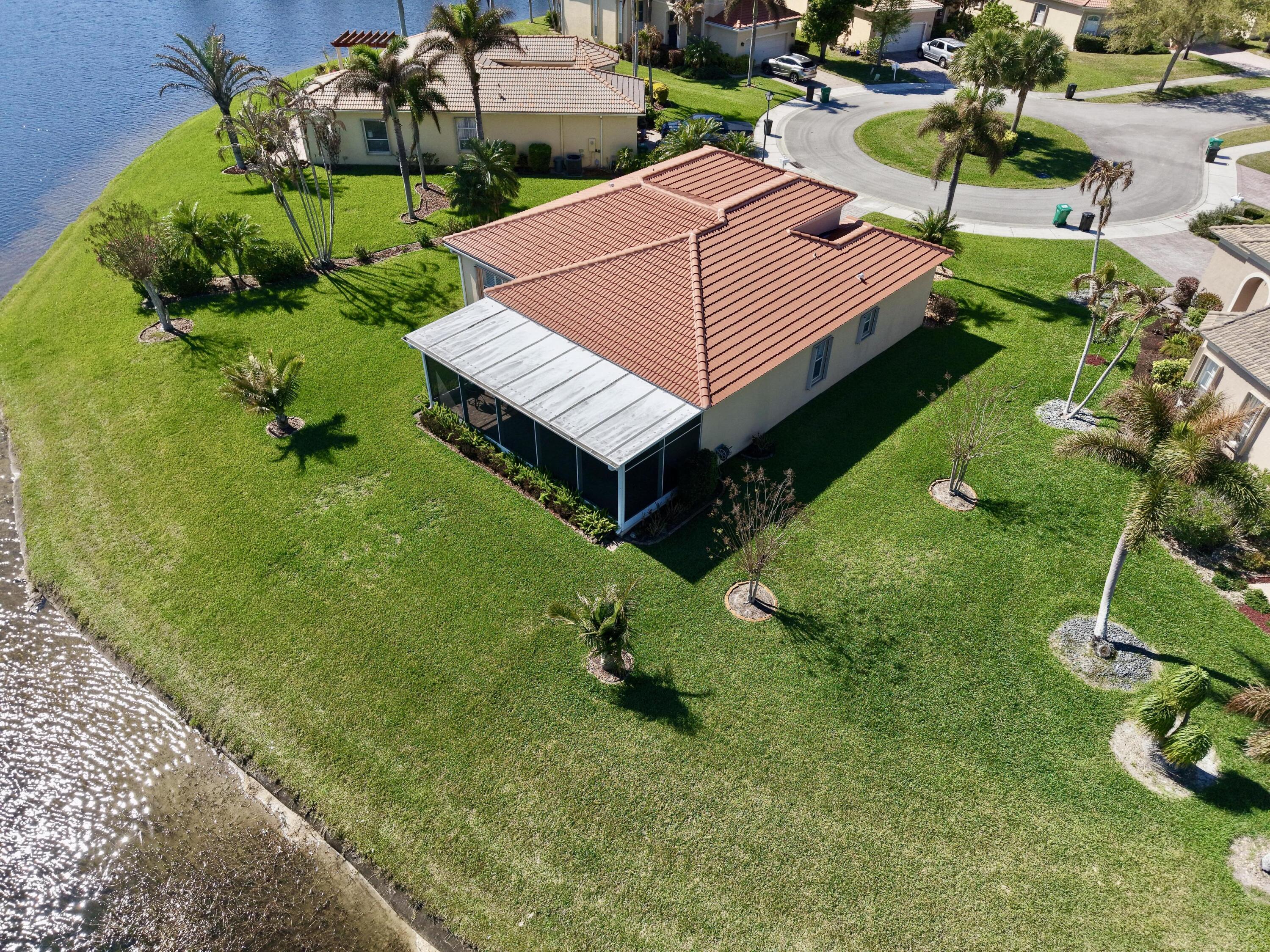 5902 Walnut Park Lane Fort Pierce, FL 34951 - Photo 5 of 45 a backyard of a house with lots of green space