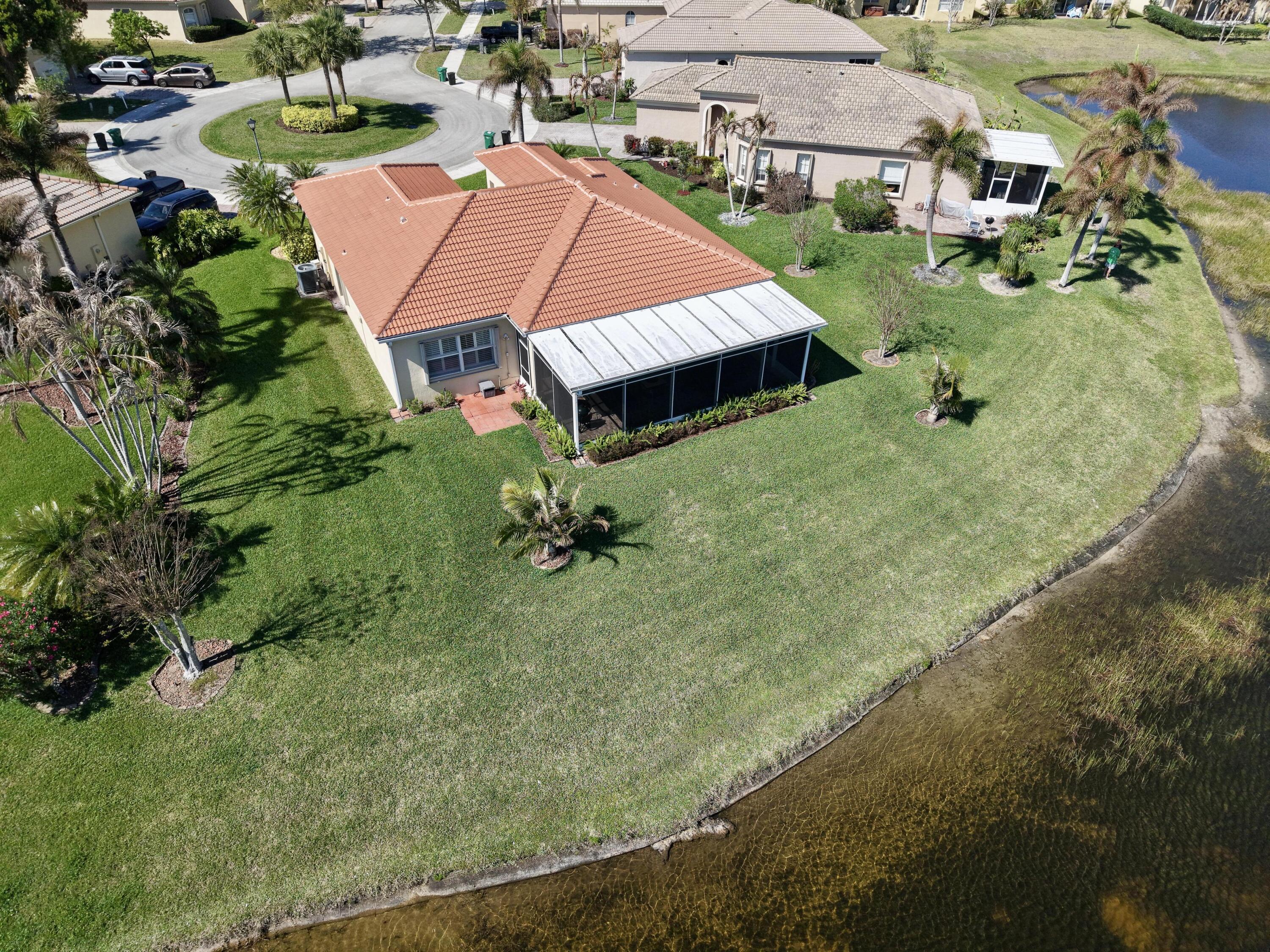 5902 Walnut Park Lane Fort Pierce, FL 34951 - Photo 6 of 45 an aerial view of a house with swimming pool yard and outdoor seating