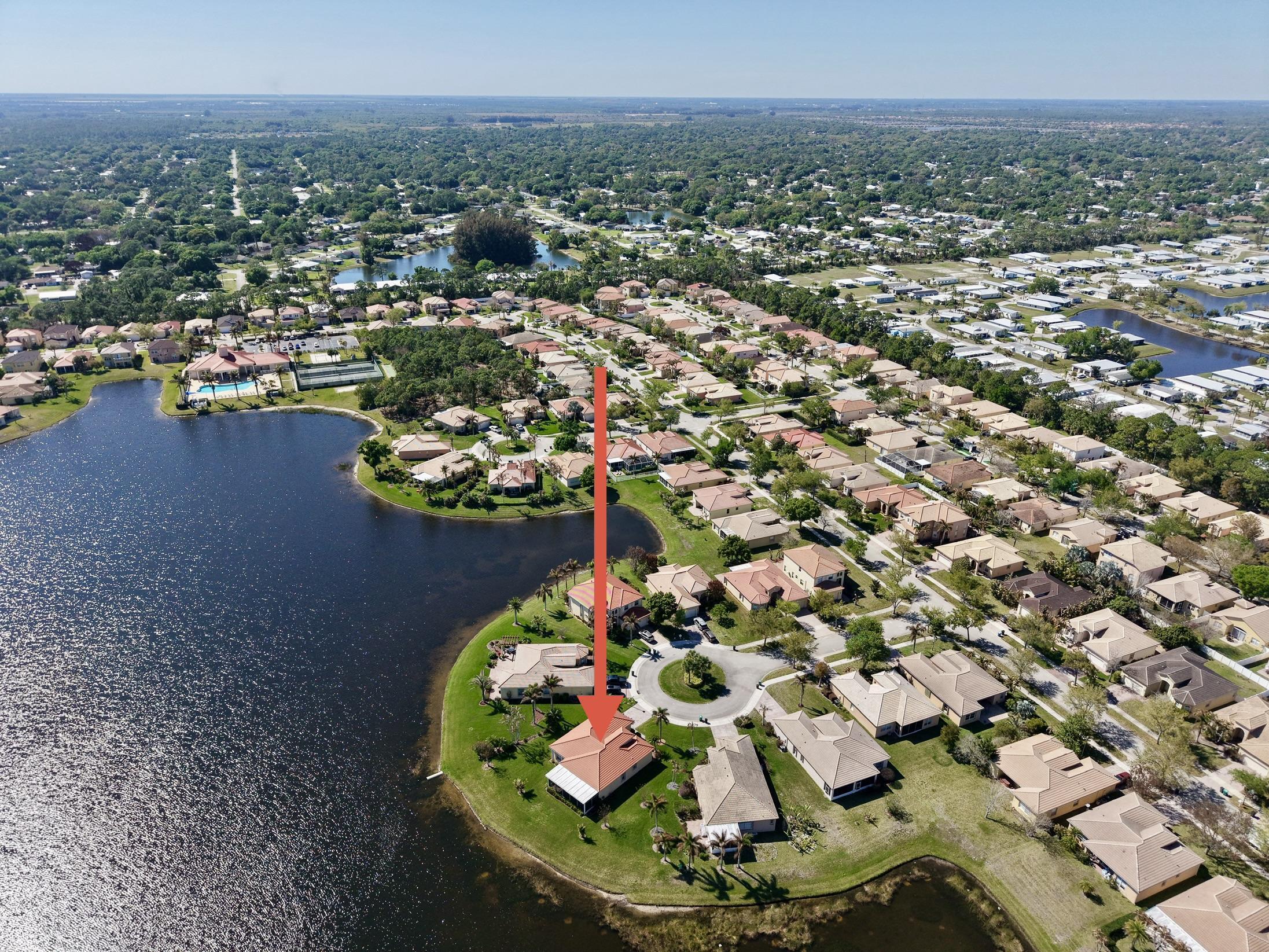 5902 Walnut Park Lane Fort Pierce, FL 34951 - Photo 7 of 45 an aerial view of residential houses with outdoor space and swimming pool