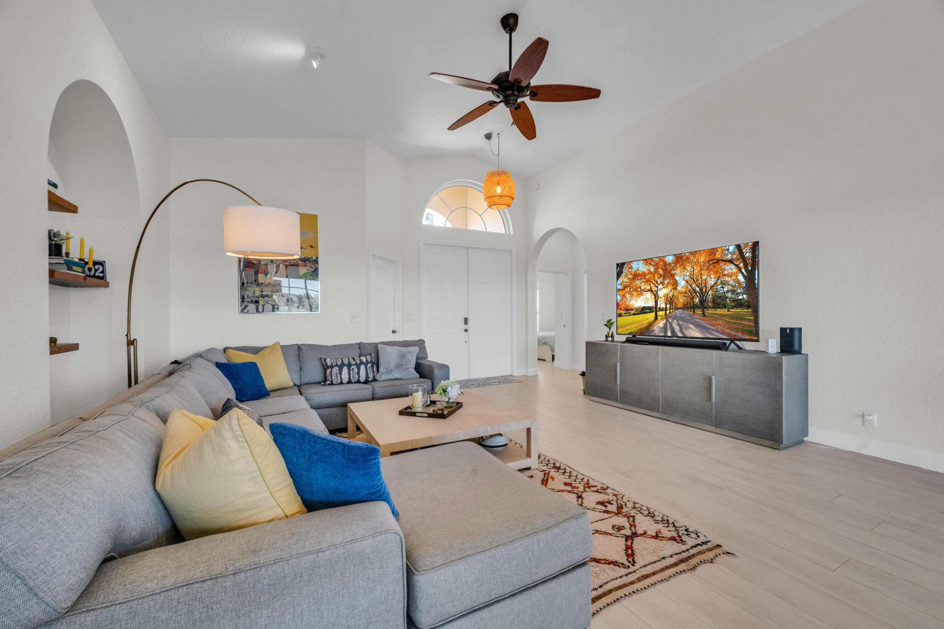 5902 Walnut Park Lane Fort Pierce, FL 34951 - Photo 10 of 45 a living room with furniture and a flat screen tv