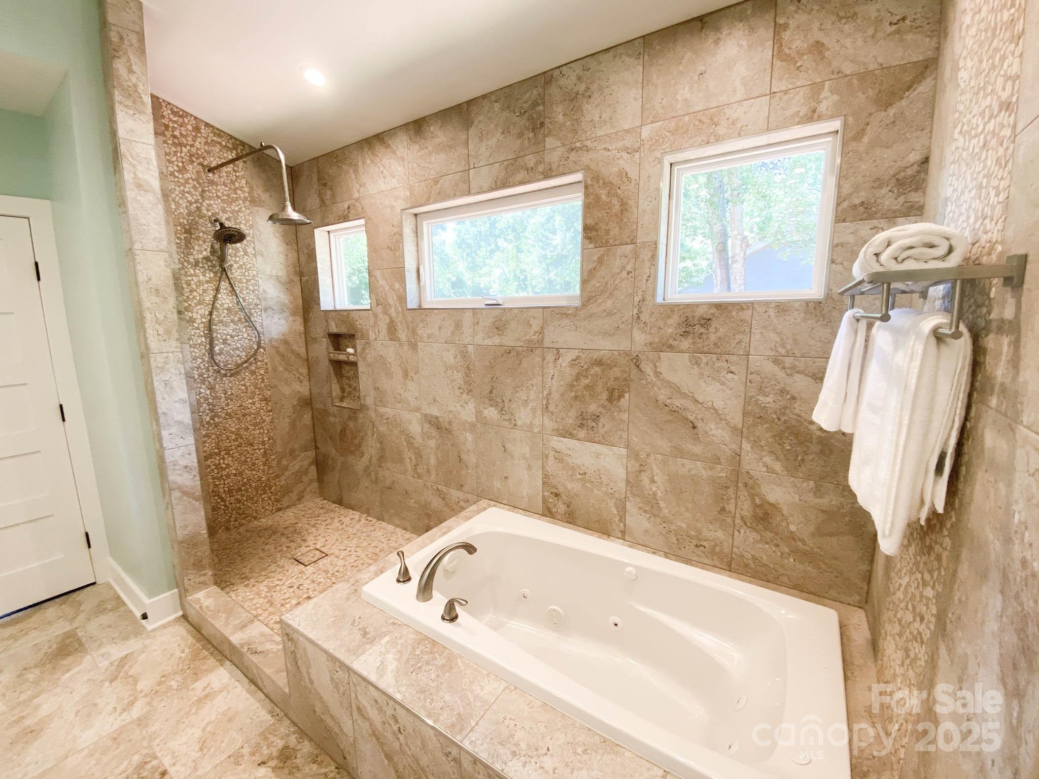 141 Carnegie Road Rutherfordton, NC 28139 - Photo 16 of 48 a bathroom with a tub sink and mirror