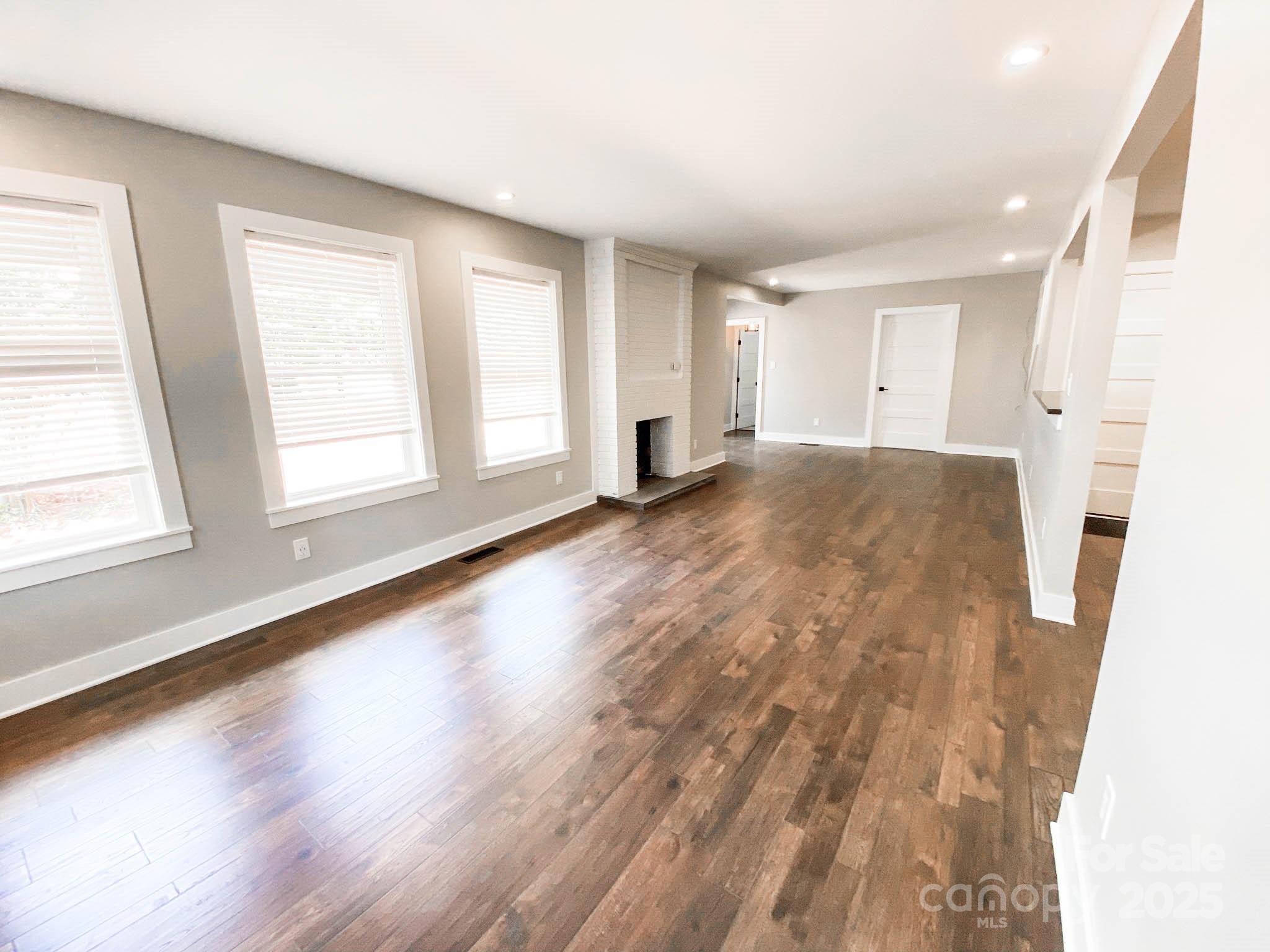 141 Carnegie Road Rutherfordton, NC 28139 - Photo 19 of 48 a view of empty room with wooden floor and fan