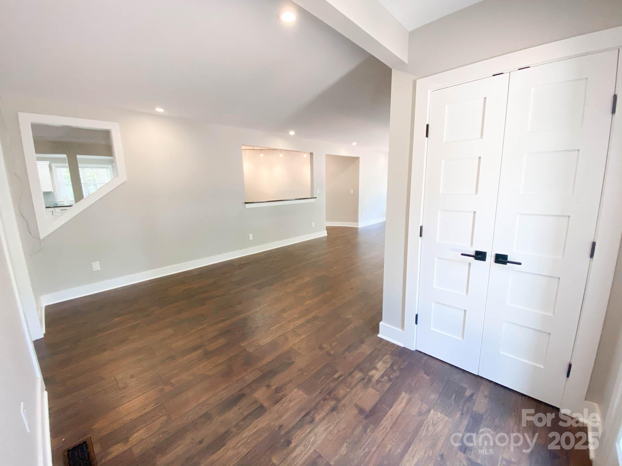 141 Carnegie Road Rutherfordton, NC 28139 - Photo 20 of 48 an empty room with wooden floor and windows