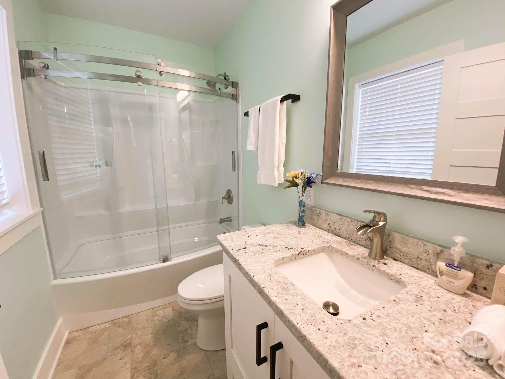 141 Carnegie Road Rutherfordton, NC 28139 - Photo 22 of 48 a bathroom with a granite countertop sink toilet and shower