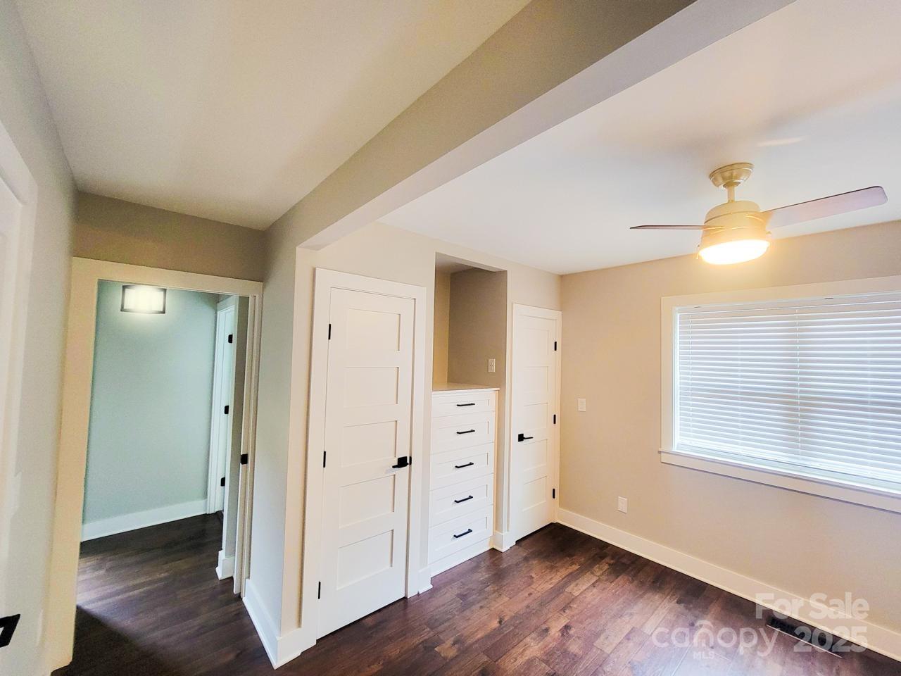141 Carnegie Road Rutherfordton, NC 28139 - Photo 23 of 48 an empty room with wooden floor and windows