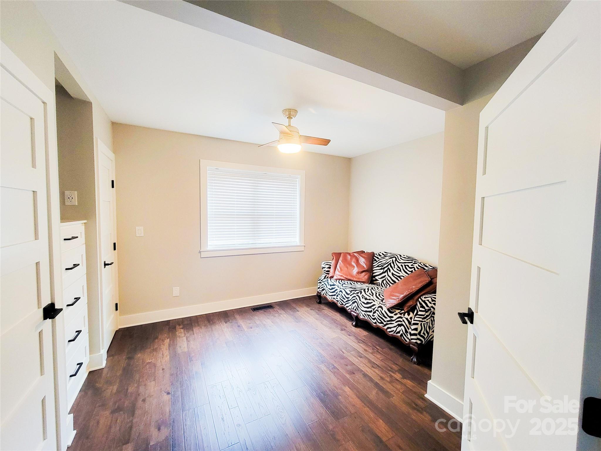 141 Carnegie Road Rutherfordton, NC 28139 - Photo 24 of 48 a living room with furniture and wooden floor