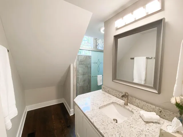 a bathroom with a sink and a mirror