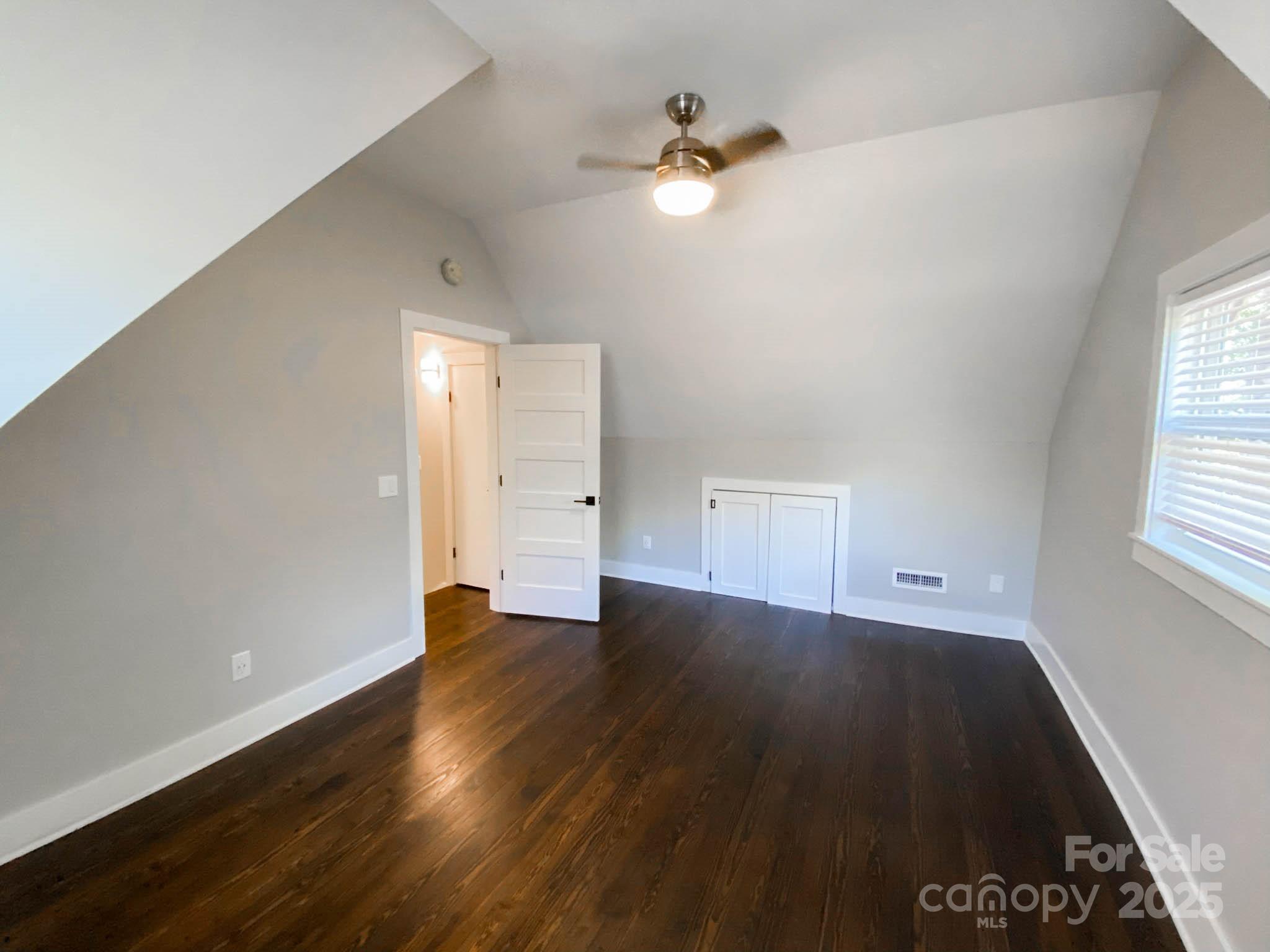141 Carnegie Road Rutherfordton, NC 28139 - Photo 31 of 48 an empty room with wooden floor and windows