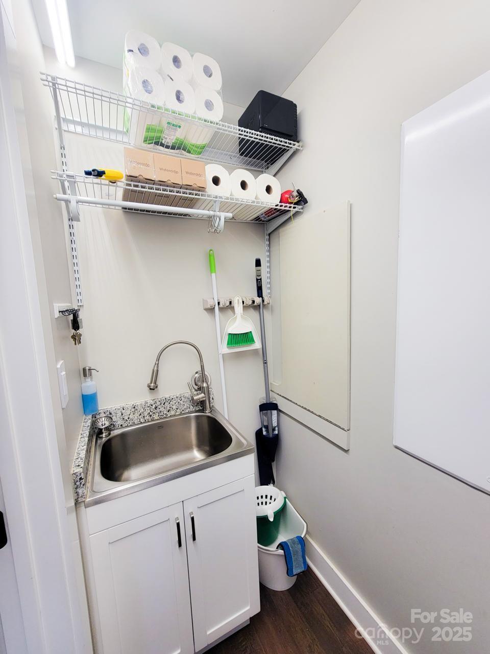 141 Carnegie Road Rutherfordton, NC 28139 - Photo 36 of 48 a kitchen with stainless steel appliances a sink a refrigerator and a counter top space